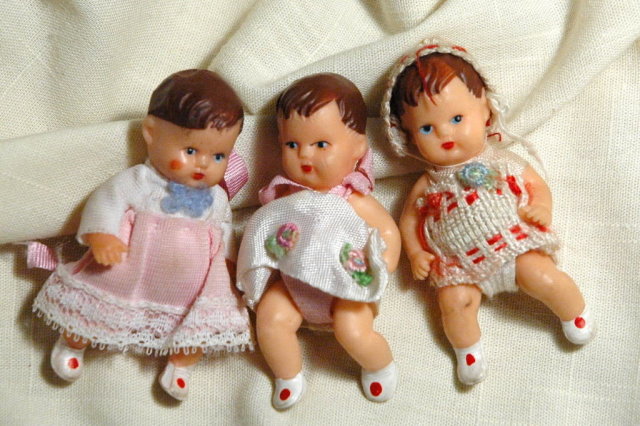 3 miniature jointed rubber baby dolls