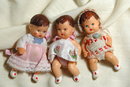 3 miniature jointed rubber baby dolls