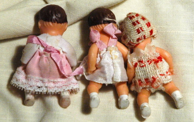 3 miniature jointed rubber baby dolls