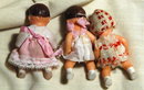 3 miniature jointed rubber baby dolls