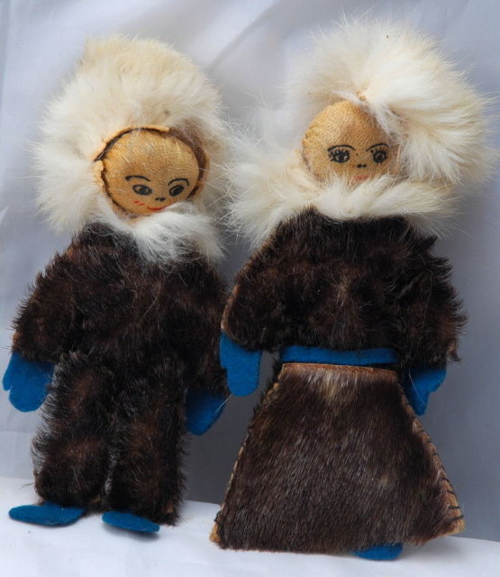 Pair of Eskimo Dolls of Seal Skin with hand painted leather faces.