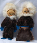 Pair of Eskimo Dolls of Seal Skin with hand painted leather faces.