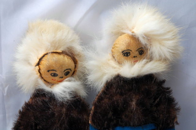 Pair of Eskimo Dolls of Seal Skin with hand painted leather faces.