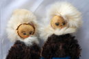 Pair of Eskimo Dolls of Seal Skin with hand painted leather faces.