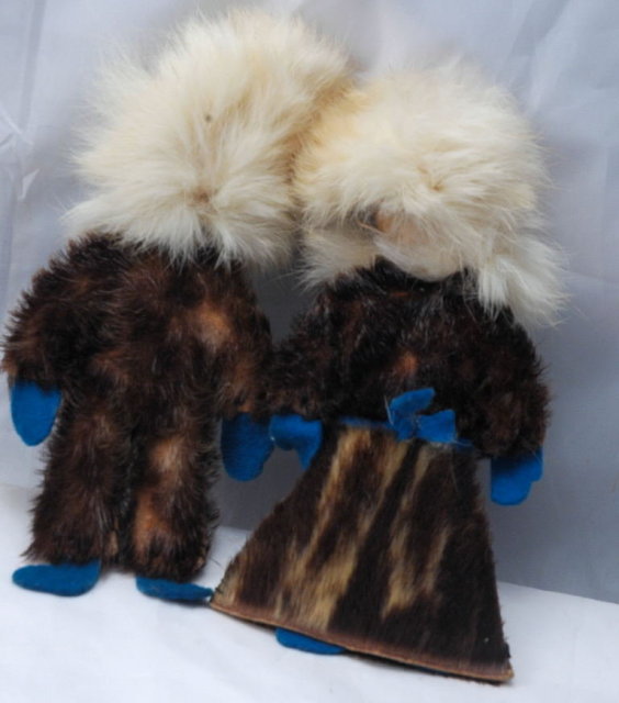 Pair of Eskimo Dolls of Seal Skin with hand painted leather faces.