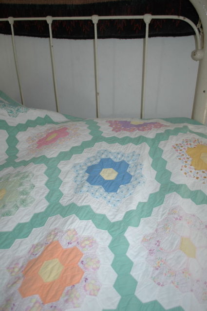 Double ring grandmother's garden hexagon quilt.