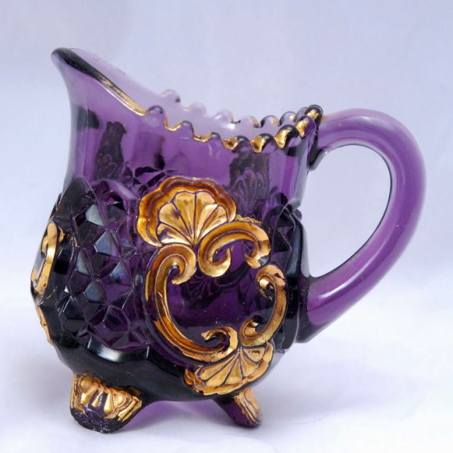 Elegant Amethyst Glass Pressed Glass Creamer with Gold Trim