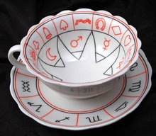 Porcelain Tea Cup and Saucer with Miscellaneous Symbols. * PRICED REDUCED! **