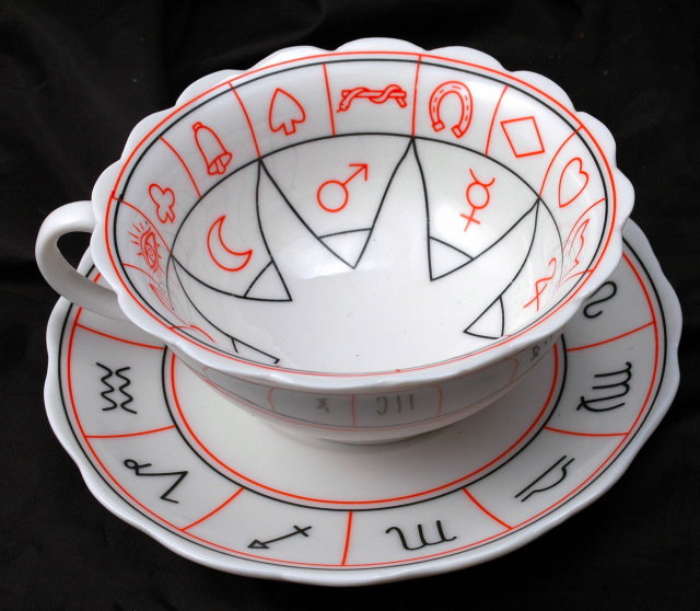 Porcelain Tea Cup and Saucer with Miscellaneous Symbols. * PRICED REDUCED! **