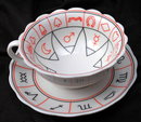 Porcelain Tea Cup and Saucer with Miscellaneous Symbols. * PRICED REDUCED! **