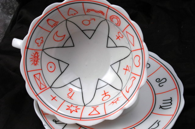 Porcelain Tea Cup and Saucer with Miscellaneous Symbols. * PRICED REDUCED! **