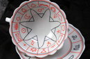 Porcelain Tea Cup and Saucer with Miscellaneous Symbols. * PRICED REDUCED! **