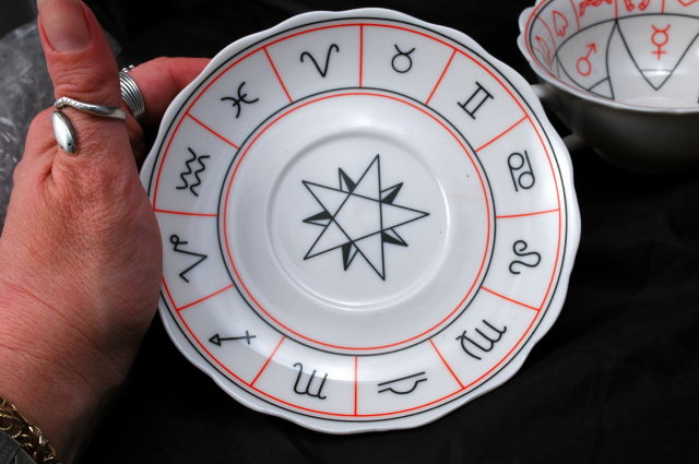 Porcelain Tea Cup and Saucer with Miscellaneous Symbols. * PRICED REDUCED! **
